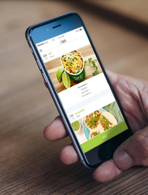 A person browsing Lish’s website on a smartphone to book sustainable corporate catering in Seattle.