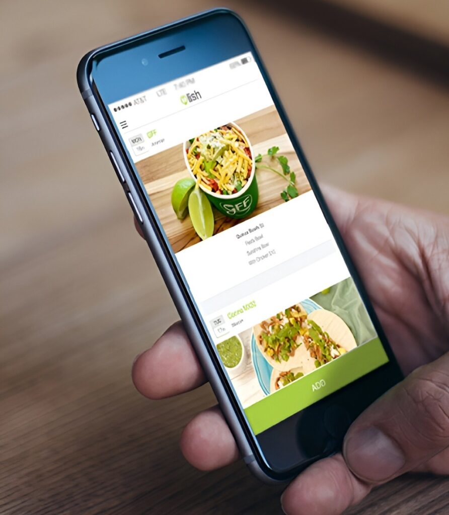 Close-up of a mobile phone screen in a person's hand, looking at the Lish menu.
