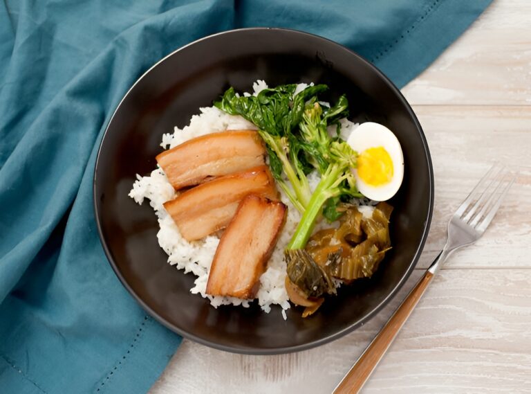 A lunch plate, consisting of Caramelized Pork belly, by Lish catering for a corporate office.