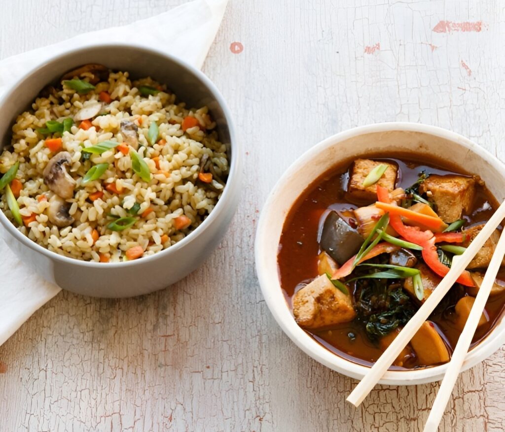 Two bowls of chilli garlic tofu and garlic rice by Lish catering.