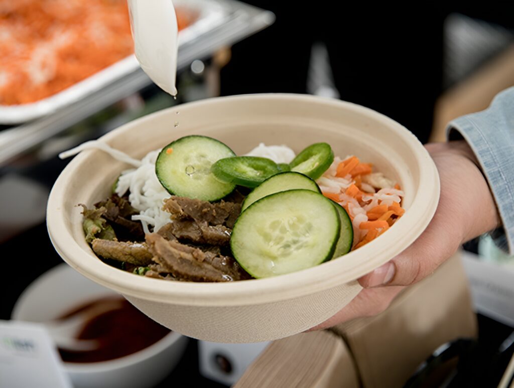 An individually served salad in a compostable bowl for office catering by Lish.
