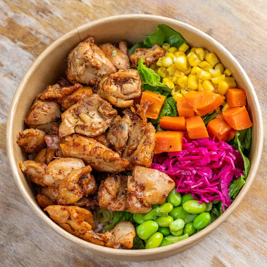 Individually packed grilled chicken rice bowl with corn, roasted carrots, pickled red cabbage and edamame, delivered by Lish Group Order