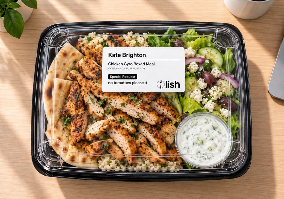 Individually boxed chicken gyro meal from Lish Group Order with a printed label showing the meal, the employee's name, dietary callouts, and a special request